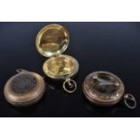 A reproduction brass pocket compass; together with two other examples (3)