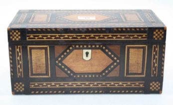 A Victorian specimen wood tea caddy of rectangular form having geometric design inlaid with oak,