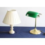 A lacquered brass desk lamp, having adjustable green glass shade; together with an alabaster table