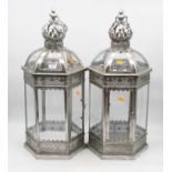 A pair of reproduction painted metal and glass outside hanging lanterns, each of domed hexagonal