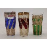 A matched set of three 19th century Bohemian overlaid glass beakers, the largest height 12.5cm