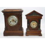 A late 19th century continental oak cased mantel clock, the silvered dial with Arabic numerals and