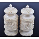A pair of early 20th century Indian ivory salt and pepper cruets, each having a removable pierced