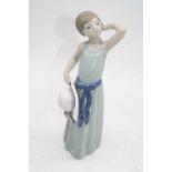 A Lladro porcelain figure of a young girl, h.24cm