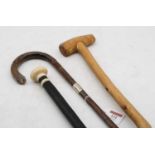 A late Victorian walking cane having an ebony shaft with turned ivory handle, monogrammed LW, length