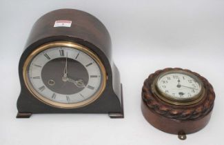 An early 20th century oak cased aneroid barometer the circular silvered dial with Arabic numerals,