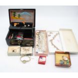 A collection of various costume jewellery to include brooches, wrist watches, and several rings