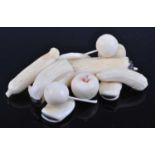 A Japanese Meiji period (1868-1912) ivory okimono, carved as a group of fruits to include a