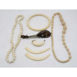 An early 20th century Indian faux ivory bead necklace, together with an African ivory bangle,