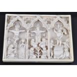 A 19th century North European ivory plaque of rectangular form, the three panels relief carved as