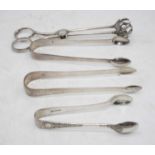 A pair of George III silver sugar tongs, having bright cut engraved decoration; together with