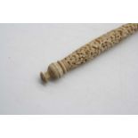 A 19th century parasol, the Chinese Canton ivory handle and stem profusely carved with dragons and