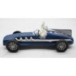 A reproduction cast iron advertising model of Michelin Man driving a sports car, 25.5cm