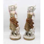 A pair of large early 20th century Royal Dux figures, each in the form of a female water-carrier