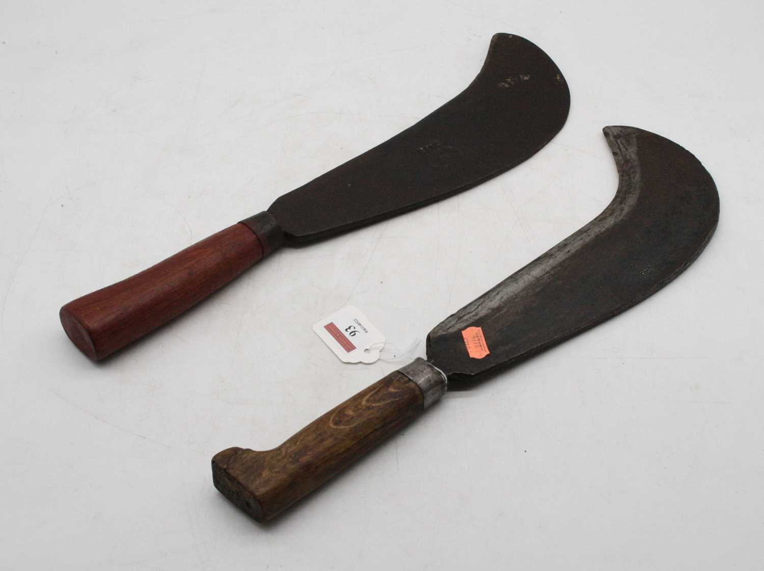 A WWII military bill-hook, the 27cm curved steel blade with broad arrow dated 1944, on turned