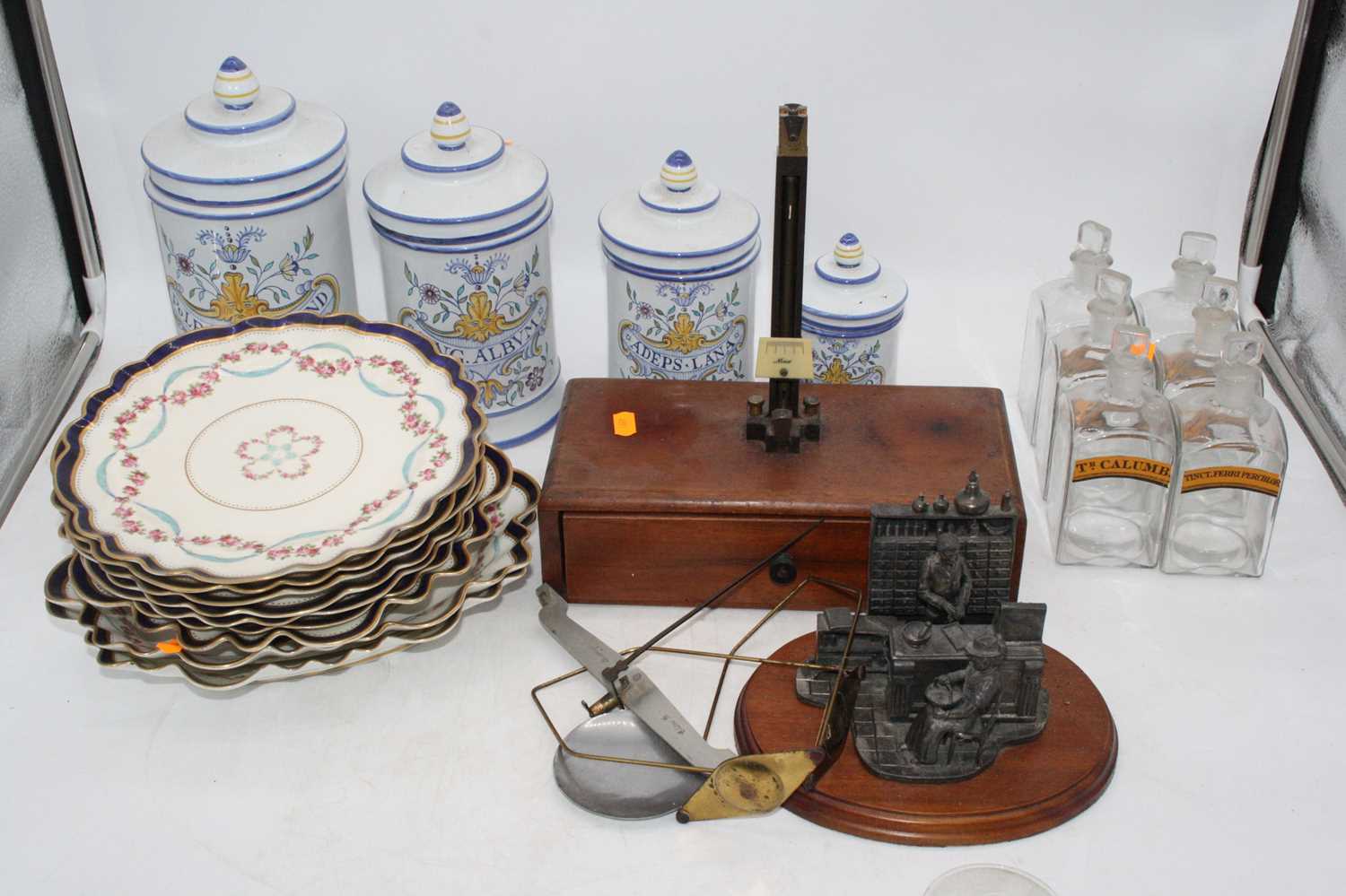 A box of miscellaneous items to include Italian Mailoica glazed storage jars and covers, 19th