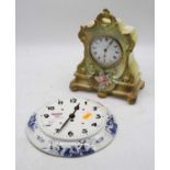 A 20th century continental porcelain cased mantel clock, on a green ground with pink rose
