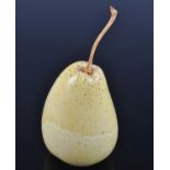 A Japanese late Meiji period (1868-1912) ivory okimono, carved as a pear with long stalk, h.11.5cm.