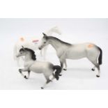 A Beswick huntsman's horse, model No.1484, white matt, h.17cm; together with two other Beswick