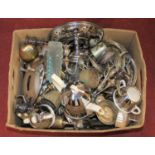 A box of metalware, to include a silver plated table candelabra, table pheasant etc