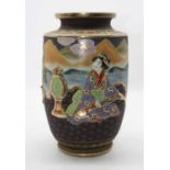 A Japanese Taisho period vase, relief decorated with various figures within a mountainous landscape,