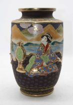 A Japanese Taisho period vase, relief decorated with various figures within a mountainous landscape,