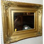 An early 20th century small floral gilt decorated rectangular wall mirror, 42 x 47.5cm