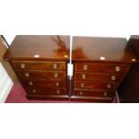 A pair of mahogany and satinwood inlaid bedside chests of four long graduated drawers, width 53.