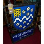 A cast iron and painted double sided Westminster Bank street sign, with singular fixing point, 77