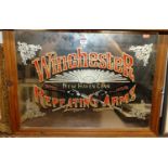 An advertising wall mirror for Winchester Repeating Arms of New Haven Connecticut, in pine frame, 52