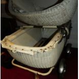 A 1950s chrome framed and wicker pram