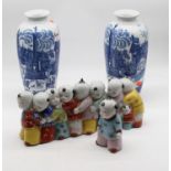 A pair of blue & white vases of baluster form underglaze blue decorated with various figures