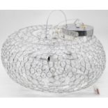 A modern ceiling light fitting of compressed circular form and wirework construction with faux