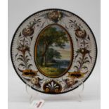 A late 18th/early 19th century Italian maiolica glazed dish, the centre decorated with lake scene