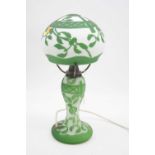 A Gallé style cameo glass table lamp having an opalescent mushroom shaped shade with green floral