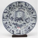 An 18th century Delft charger underglaze blue decorated with the Lion of Judah within further