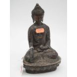 A reproduction hollow cast alloy model of a deity in seated lotus pose, height 21cm