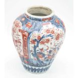 A Japanese late Meiji period vase of fluted baluster form decorated in the Imari palette in shades