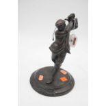 A reproduction bronzed figure of a golfer in full swing on circular base, height 25cmIntact and