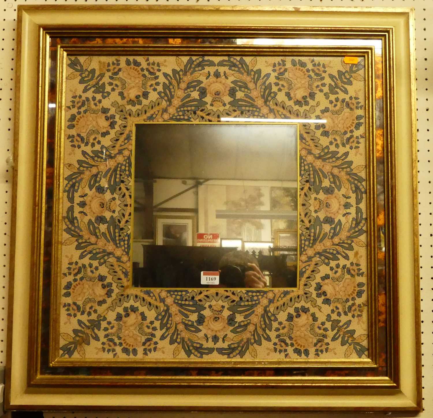 A contemporary floral decorated square wall mirror, 71.5 x 71.5cm