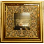 A contemporary floral decorated square wall mirror, 71.5 x 71.5cm