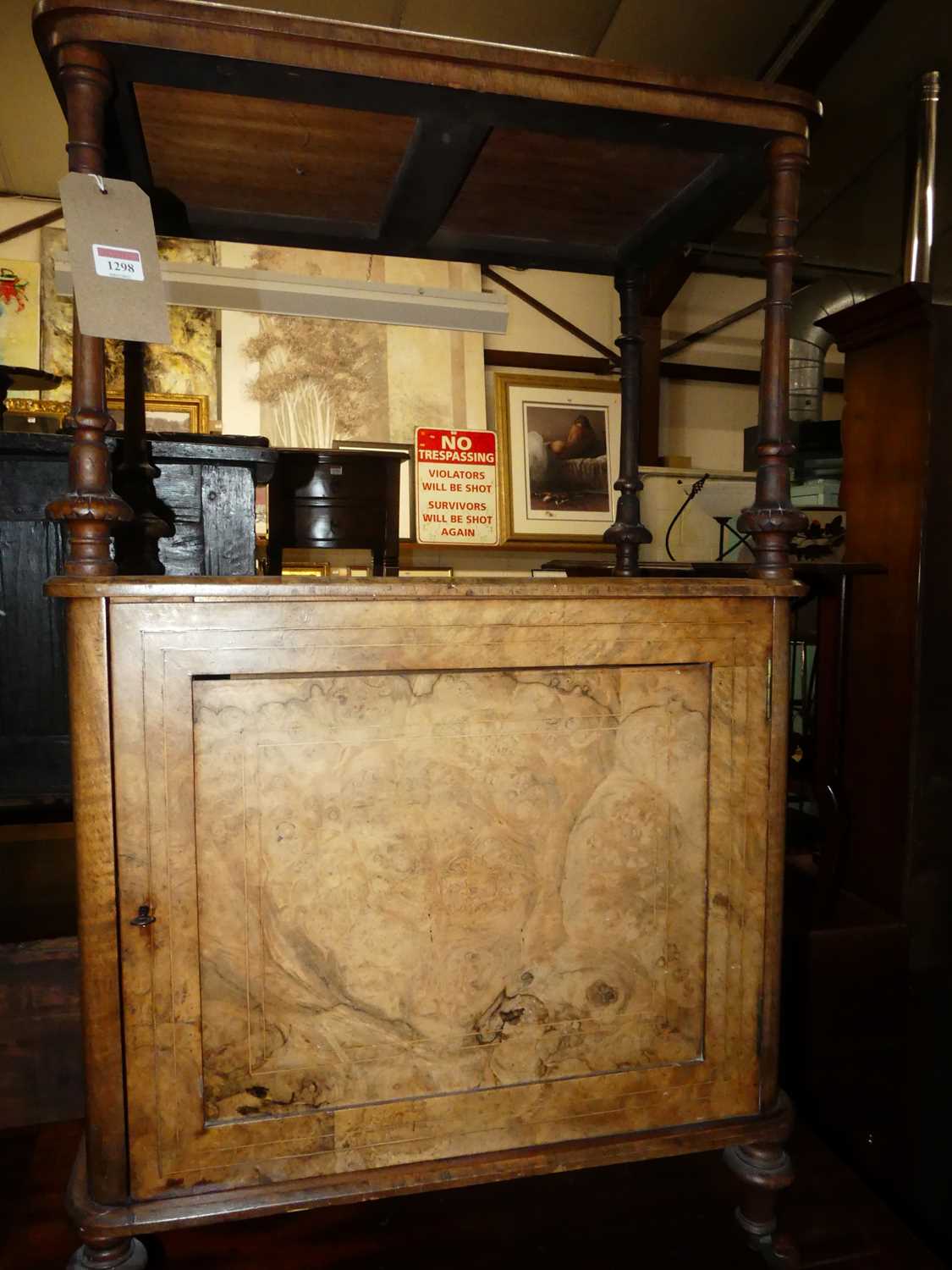 A mid-Victorian figured walnut round cornered music cabinet, having pierced three-quarter gallery