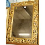 A 19th century Italianate Rococo Revival gilt composition picture frame, having later inset