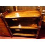 A Victorian mahogany three-tier buffet, having reeded finials over conforming supports, to