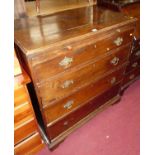 An early 19th century provincial oak chest of four long graduated drawers, with upper brushing slide