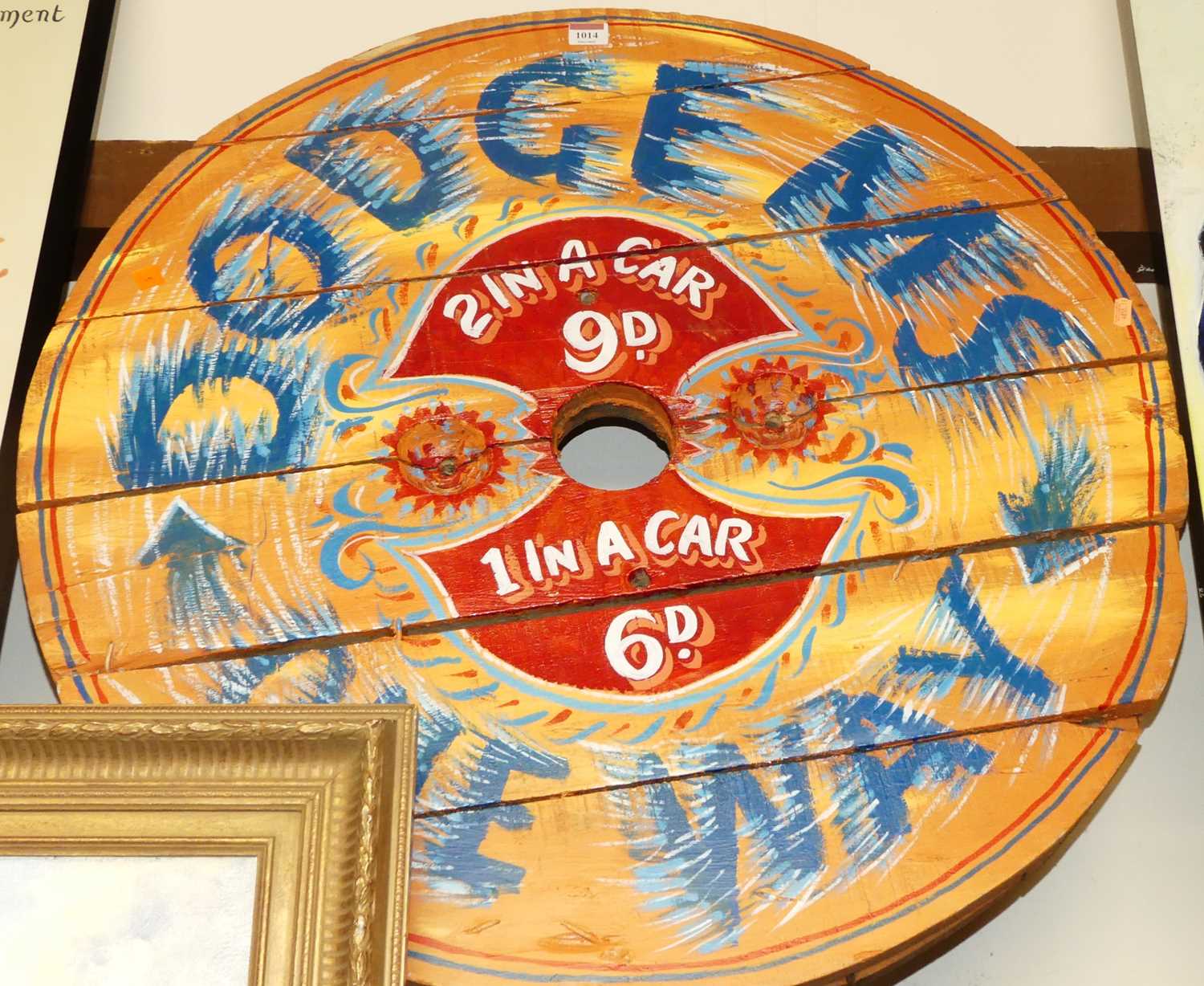 A reproduction painted wooden fairground sign, dia.82cm