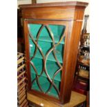 A 19th century mahogany and astragal glazed single door hanging corner cupboard; together with a