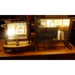 Two 19th century mahogany swing toilet mirrors; together with a rosewood and brass inlaid example (