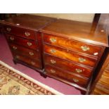 A pair of small mahogany square front chests, each of four long graduated drawers, width 58cm