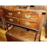 A mahogany single drawer side table, the large drawer fashioned as two short over one drawer, raised